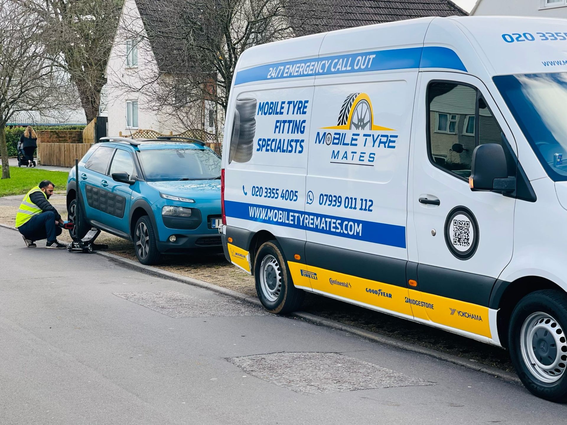 Tyre Mates van and engineer servicing a car at the kerbside